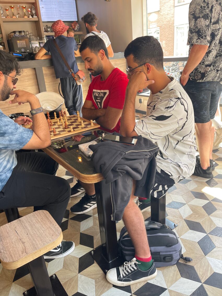 Watching a spirited chess match that came down to king against king at Coffeeshop Relax! in Amsterdam.